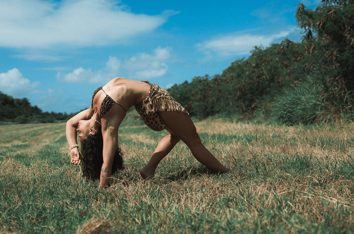 Yoga bridge movement practiced outdoors